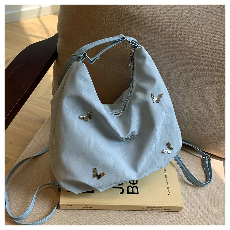 Silver Butterfly Shoulder Bag with Pom Pom Charm — feature 19