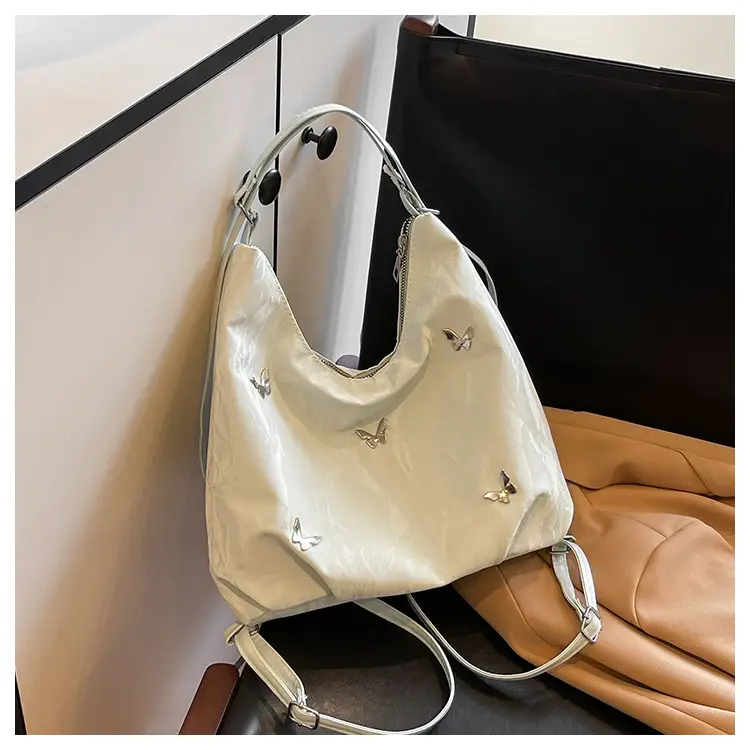 Silver Butterfly Shoulder Bag with Pom Pom Charm — feature 21