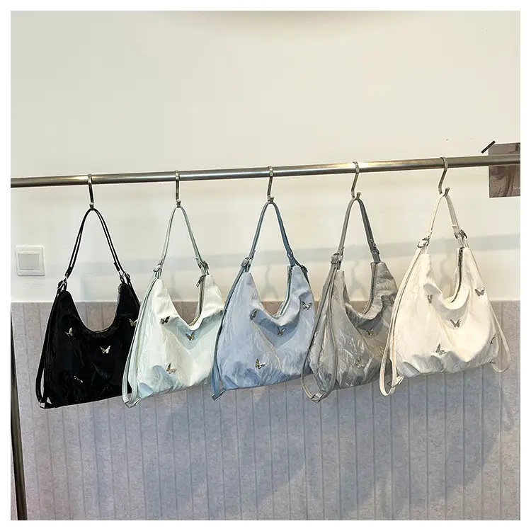 Silver Butterfly Shoulder Bag with Pom Pom Charm — feature 24
