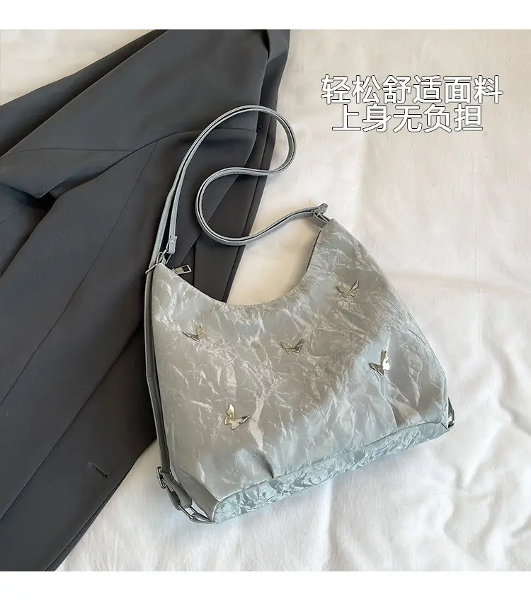 Silver Butterfly Shoulder Bag with Pom Pom Charm — feature 3