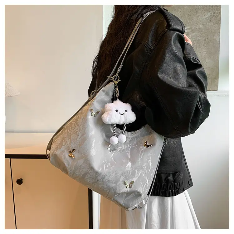 Silver Butterfly Shoulder Bag with Pom Pom Charm — feature 7