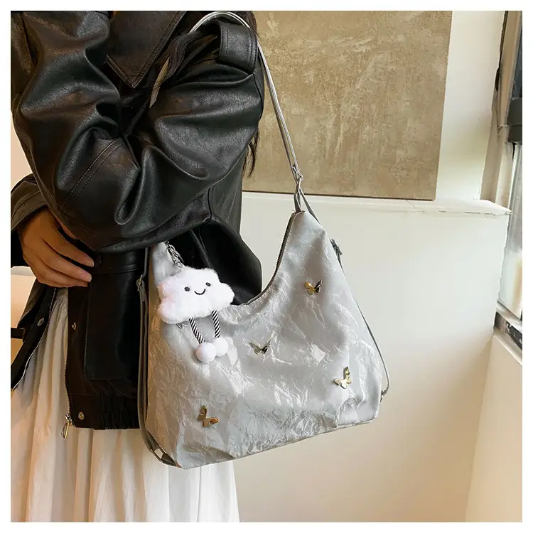 Silver Butterfly Shoulder Bag with Pom Pom Charm — feature 8
