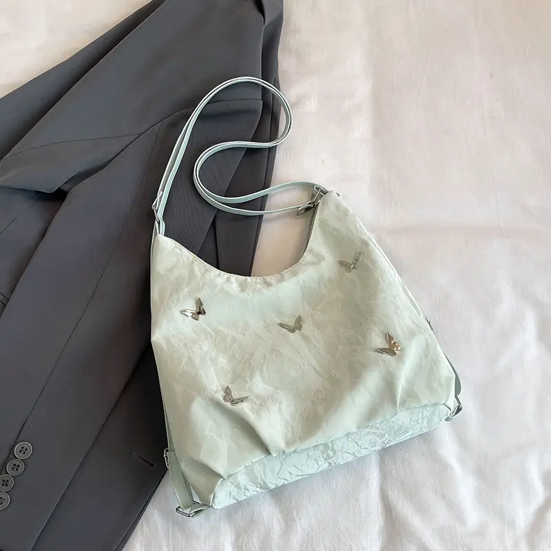 Silver Butterfly Shoulder Bag with Pom Pom Charm - Image 3