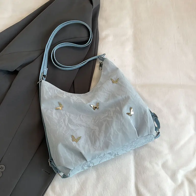 Silver Butterfly Shoulder Bag with Pom Pom Charm - Image 4