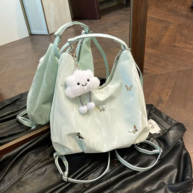 Silver Butterfly Shoulder Bag with Pom Pom Charm - Image 8