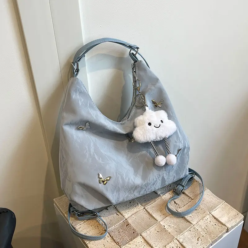 Silver Butterfly Shoulder Bag with Pom Pom Charm - Image 9