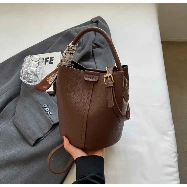 Black Leather Bucket Bag with Crossbody Strap — feature 24