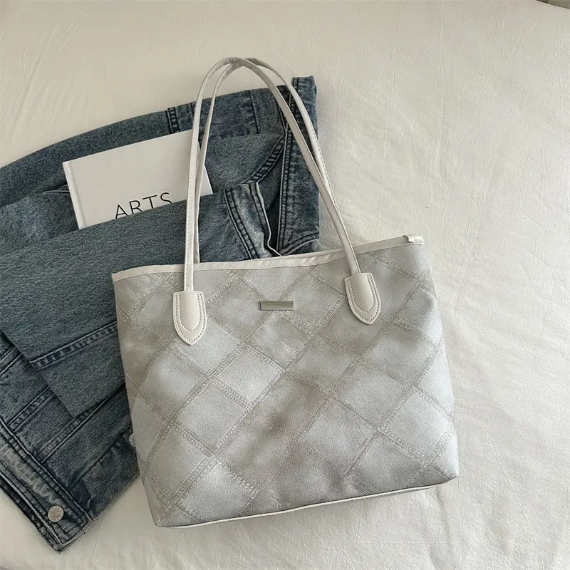 Women's Silver Quilted Shoulder Bag with Cute Pom Pom Design - Image 2