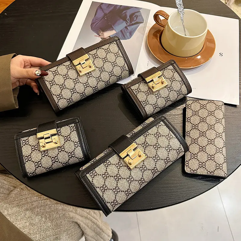 Cross-border high-end wallet women's new short multi-card three-fold buckle hand-held long wallet for hair