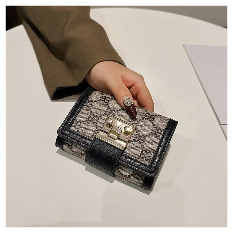Cross-border high-end wallet women's new short multi-card three-fold buckle hand-held long wallet for hair — feature 34