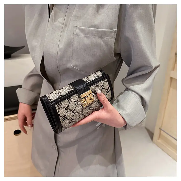 Cross-border high-end wallet women's new short multi-card three-fold buckle hand-held long wallet for hair — feature 38