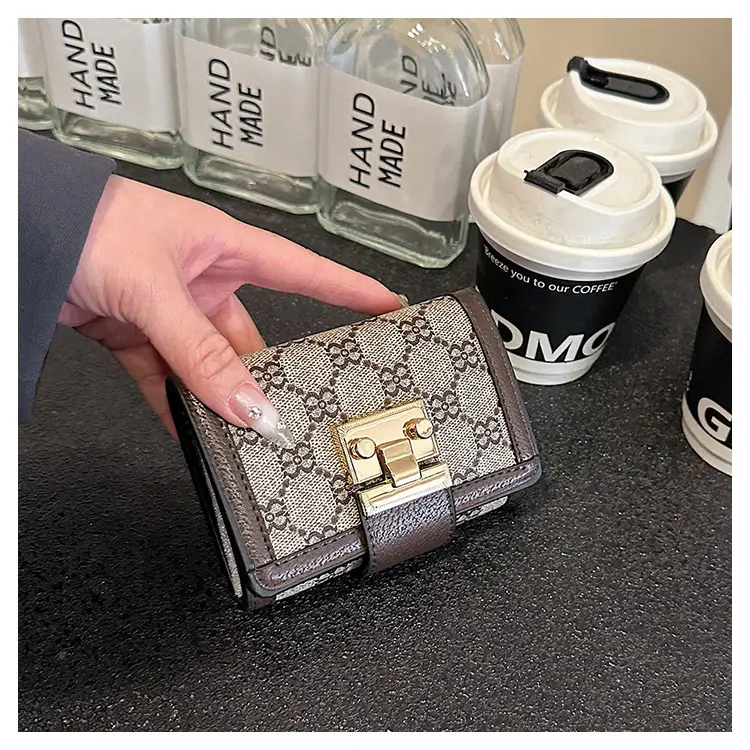 Cross-border high-end wallet women's new short multi-card three-fold buckle hand-held long wallet for hair — feature 42