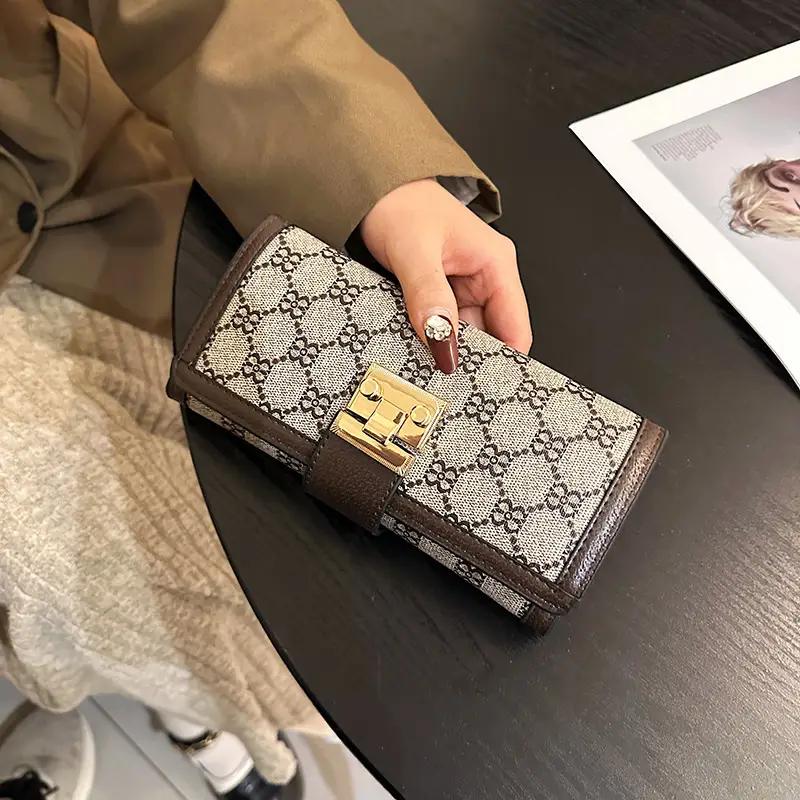 Cross-border high-end wallet women's new short multi-card three-fold buckle hand-held long wallet for hair