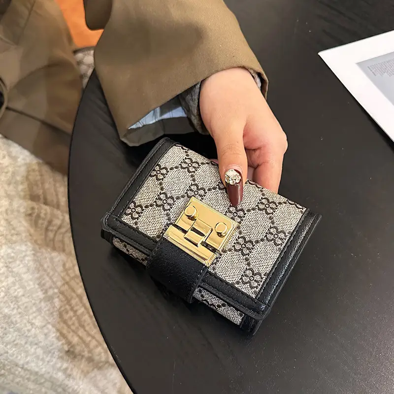 Cross-border high-end wallet women's new short multi-card three-fold buckle hand-held long wallet for hair