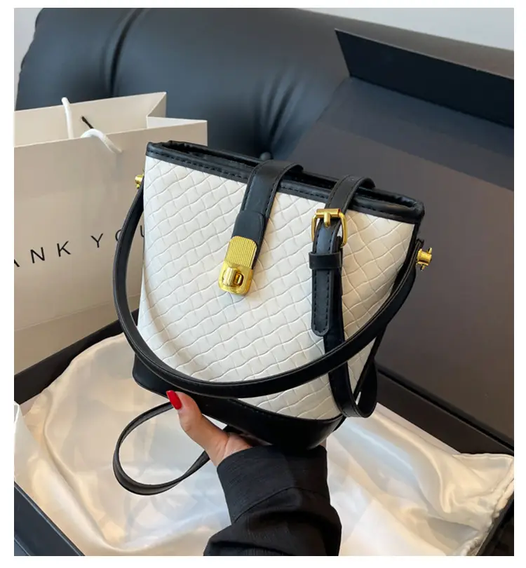 Black Quilted Crossbody Bag with Gold Clasp — feature 1
