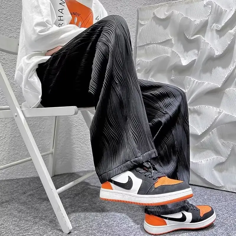 Men Knitted White Pants with Orange Sneakers — feature 23