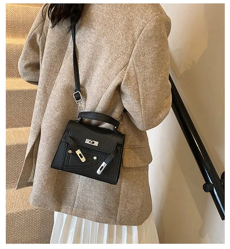 White Kelly Shoulder Bag with Litchi Clasp — feature 1