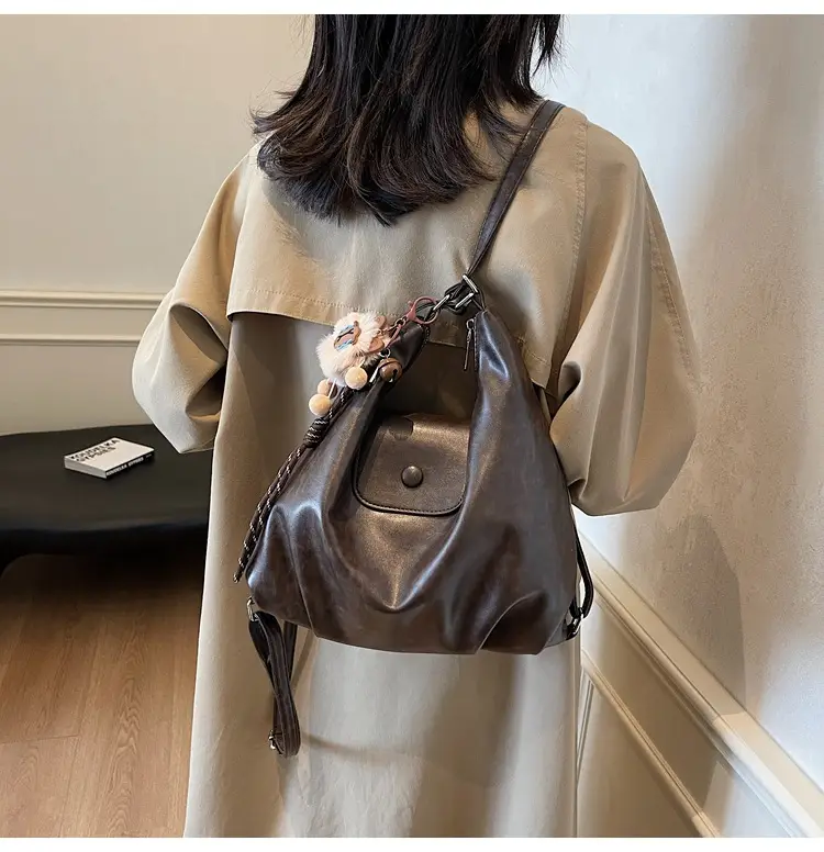 Women's Large Brown Leather Shoulder Bag with Pom Pom Charm — feature 14