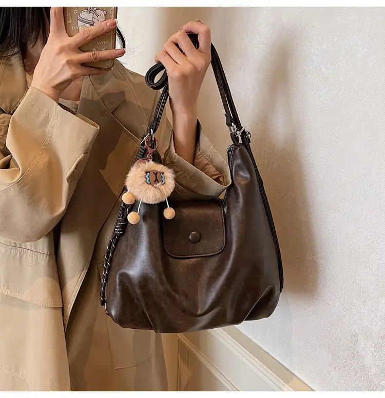 Women's Large Brown Leather Shoulder Bag with Pom Pom Charm — feature 17