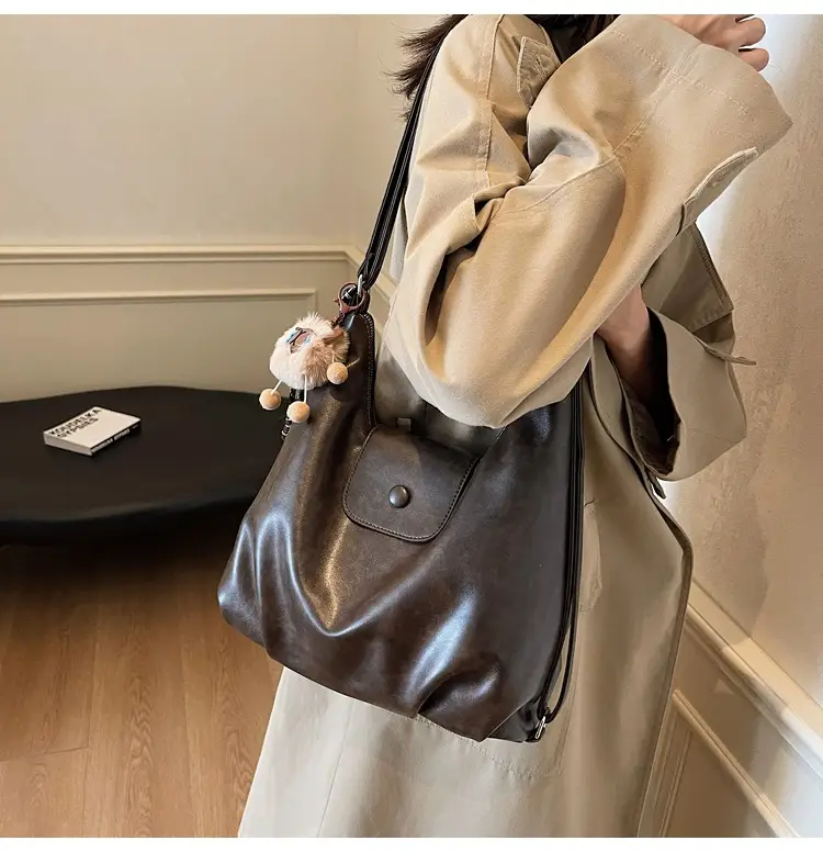 Women's Large Brown Leather Shoulder Bag with Pom Pom Charm — feature 18
