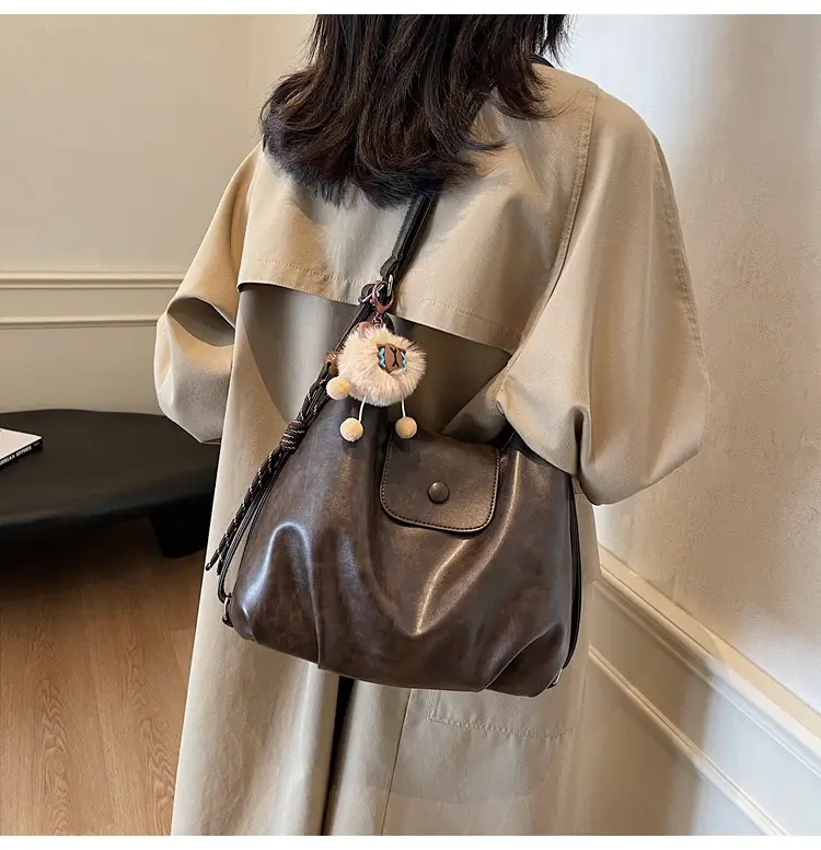 Women's Large Brown Leather Shoulder Bag with Pom Pom Charm — feature 19