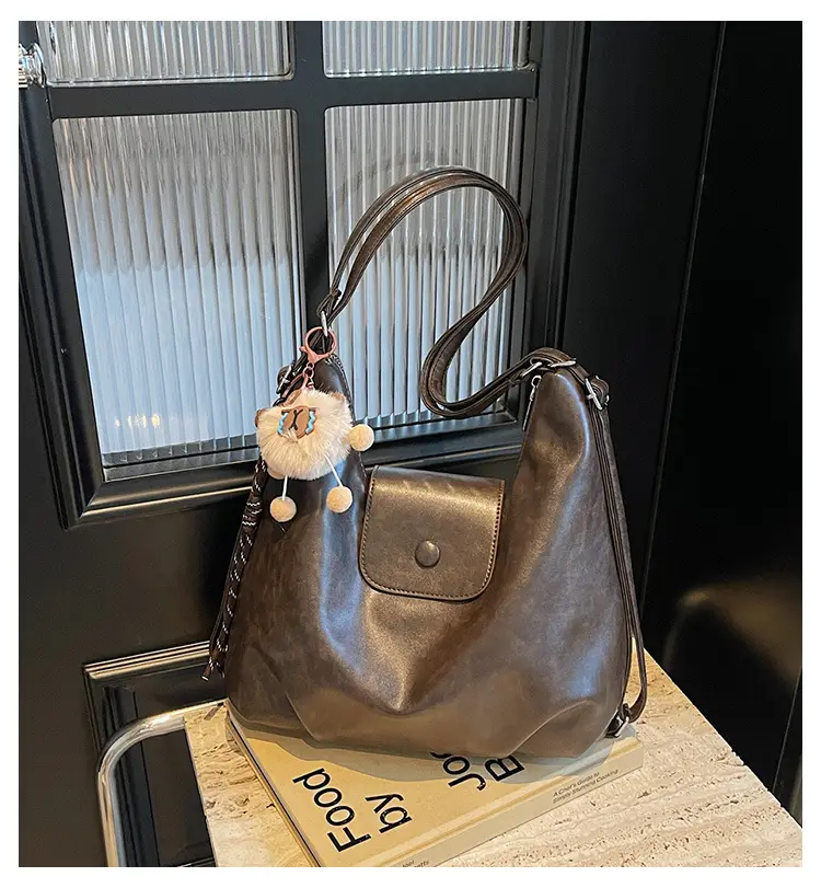 Women's Large Brown Leather Shoulder Bag with Pom Pom Charm — feature 2