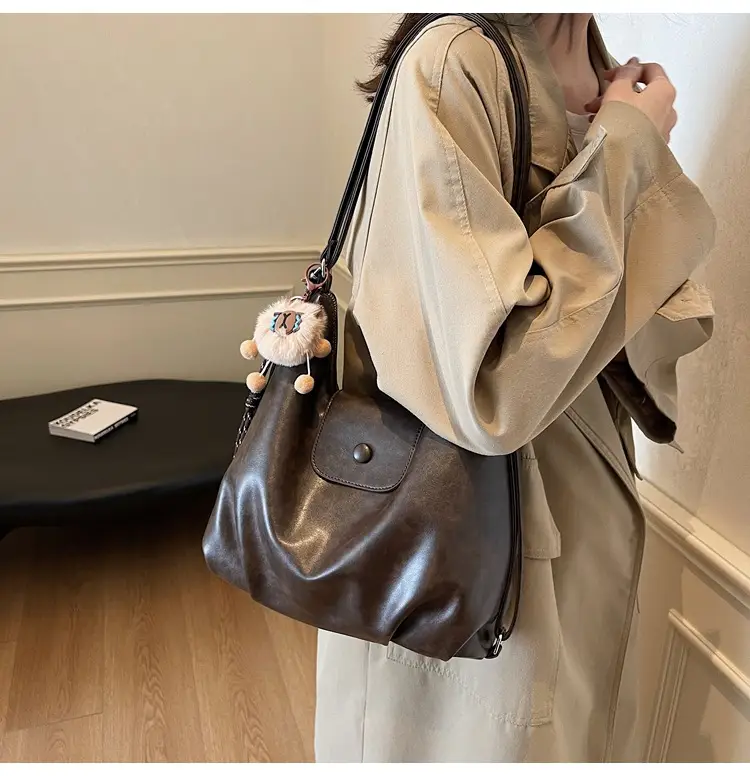 Women's Large Brown Leather Shoulder Bag with Pom Pom Charm — feature 21