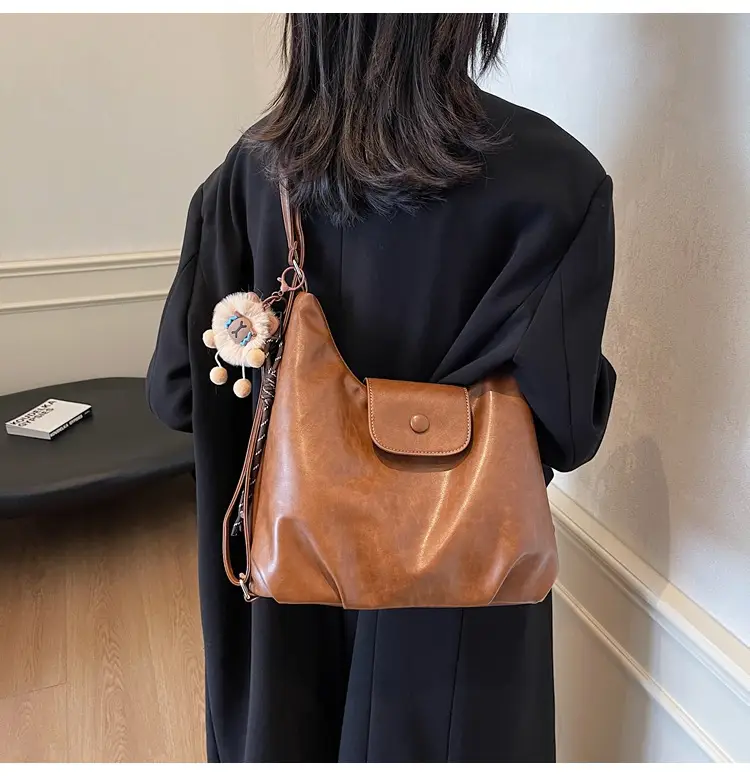 Women's Large Brown Leather Shoulder Bag with Pom Pom Charm — feature 25