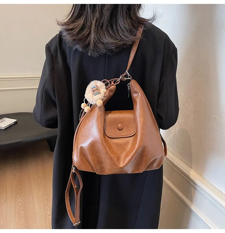 Women's Large Brown Leather Shoulder Bag with Pom Pom Charm — feature 26