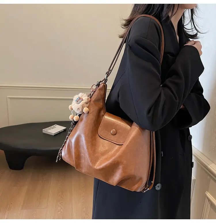 Women's Large Brown Leather Shoulder Bag with Pom Pom Charm — feature 29