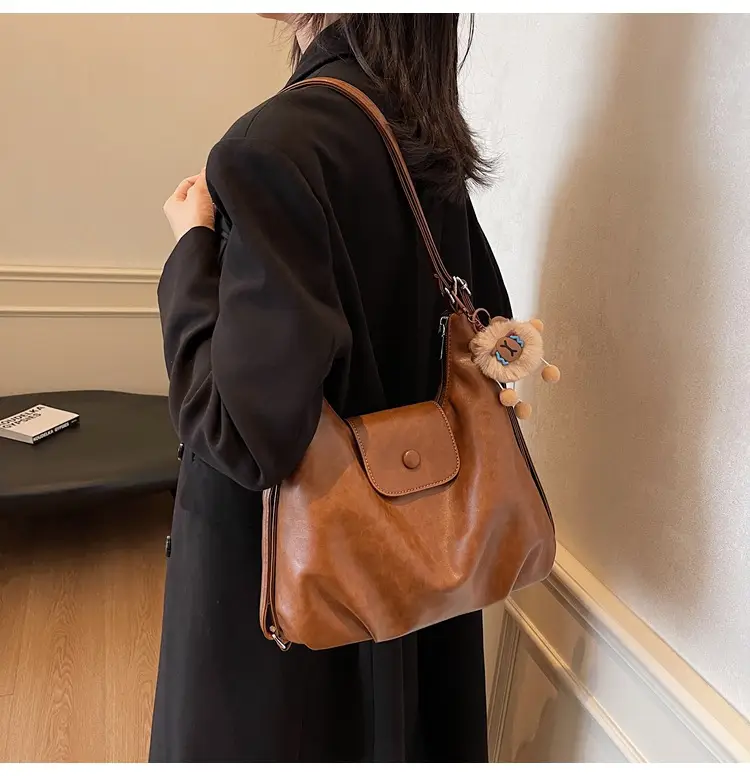 Women's Large Brown Leather Shoulder Bag with Pom Pom Charm — feature 32