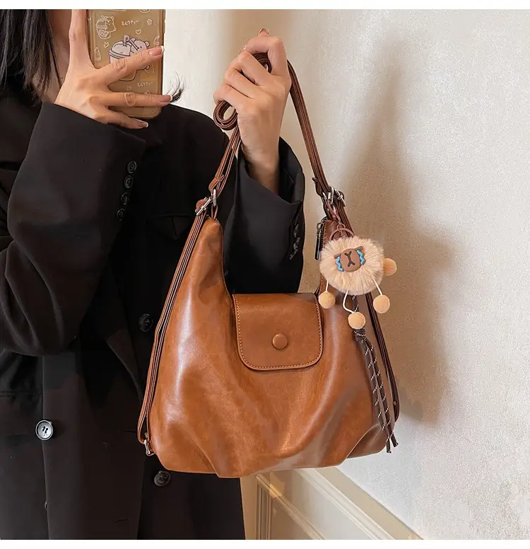 Women's Large Brown Leather Shoulder Bag with Pom Pom Charm — feature 34