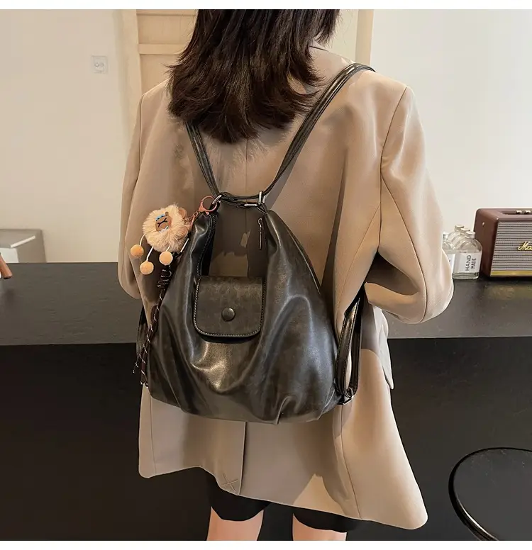Women's Large Brown Leather Shoulder Bag with Pom Pom Charm — feature 40