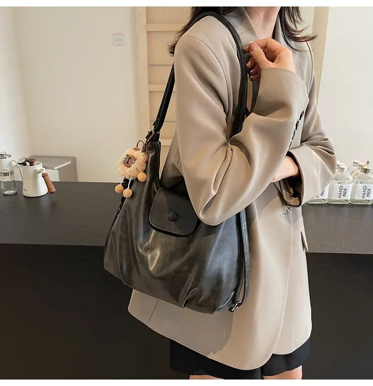 Women's Large Brown Leather Shoulder Bag with Pom Pom Charm — feature 43