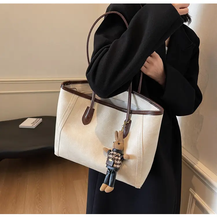 Women's Cross-Country Leather Tote Bag Cream Brown β feature 19