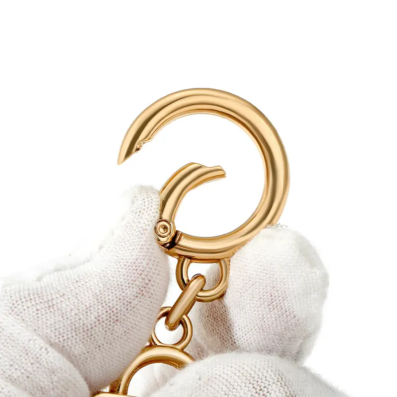 Heart-Shaped Gold Earrings with Black Polka Dot Design - Image 8