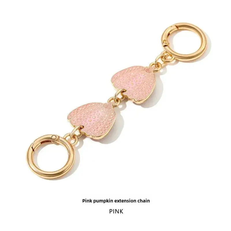 Heart-Shaped Gold Earrings with Black Polka Dot Design - Image 3