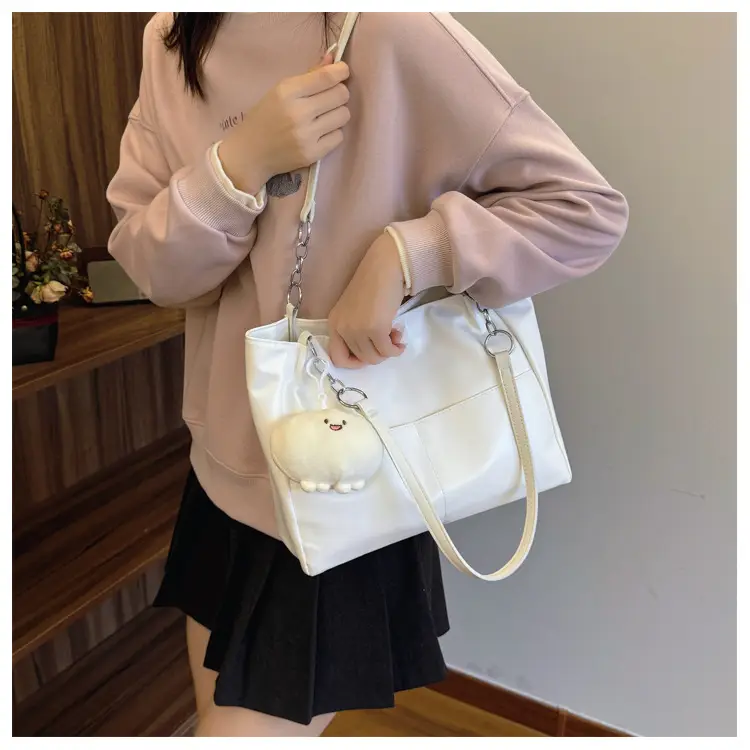 White Casual Shoulder Tote with Pom Pom Pendant — feature 11