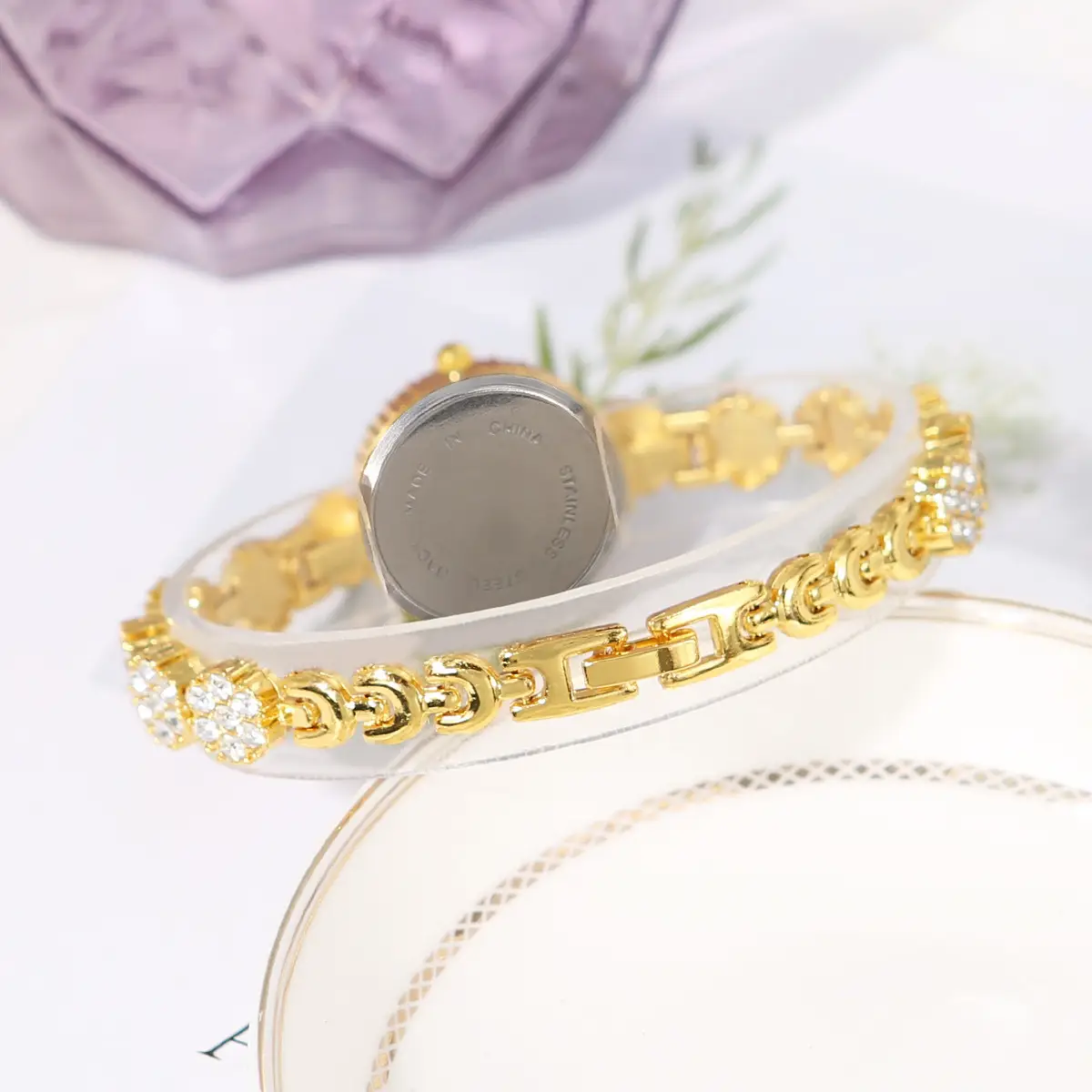 Gold Cross Bracelet Watch with Diamond Embellishment — feature 16
