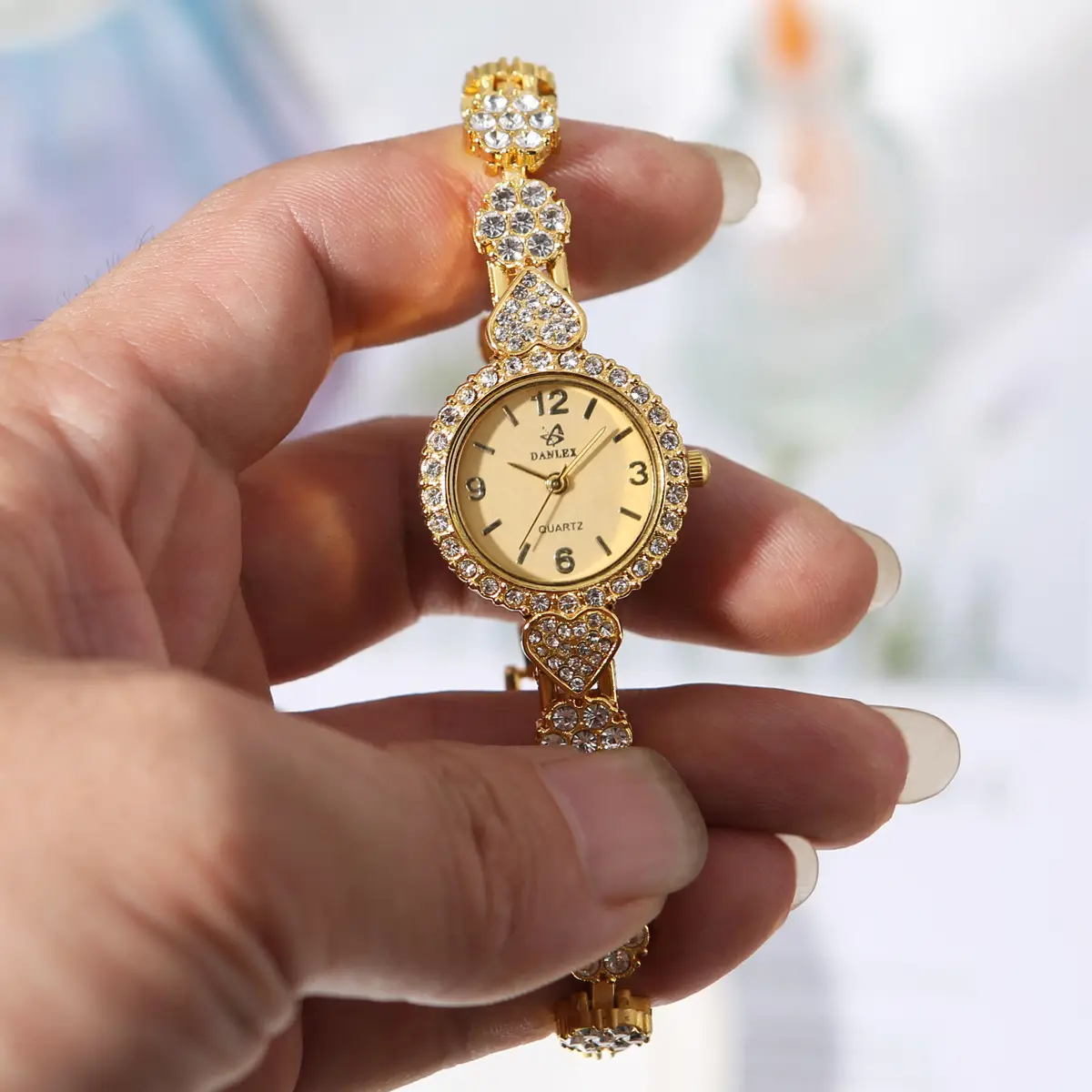 Gold Cross Bracelet Watch with Diamond Embellishment — feature 17