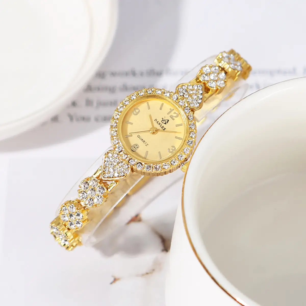 Gold Cross Bracelet Watch with Diamond Embellishment — feature 20