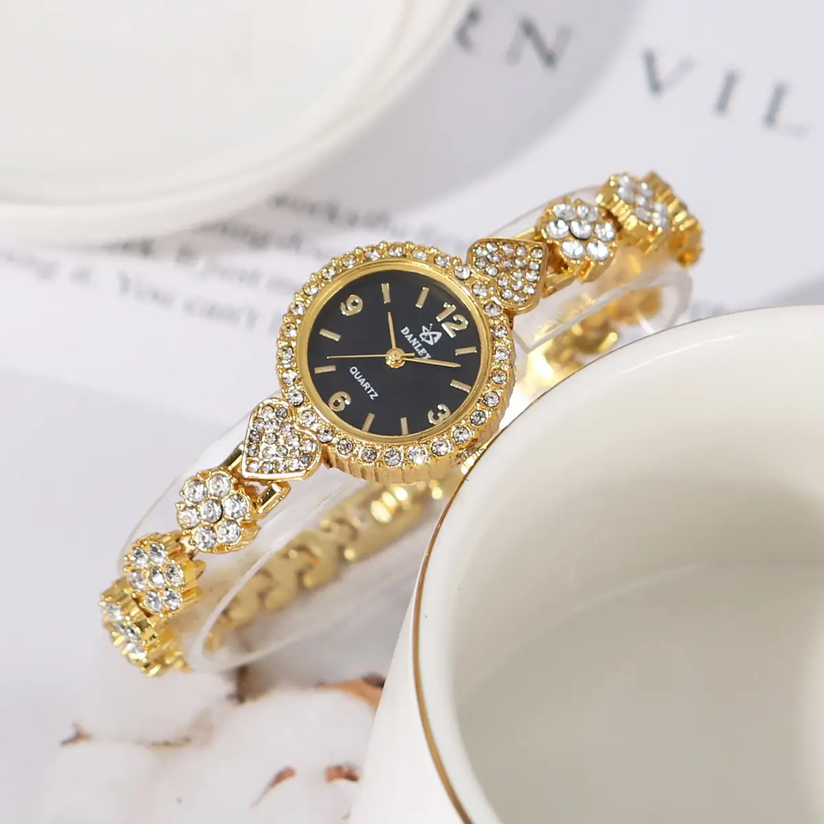 Gold Cross Bracelet Watch with Diamond Embellishment — feature 4