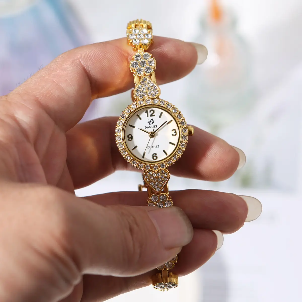 Gold Cross Bracelet Watch with Diamond Embellishment — feature 9