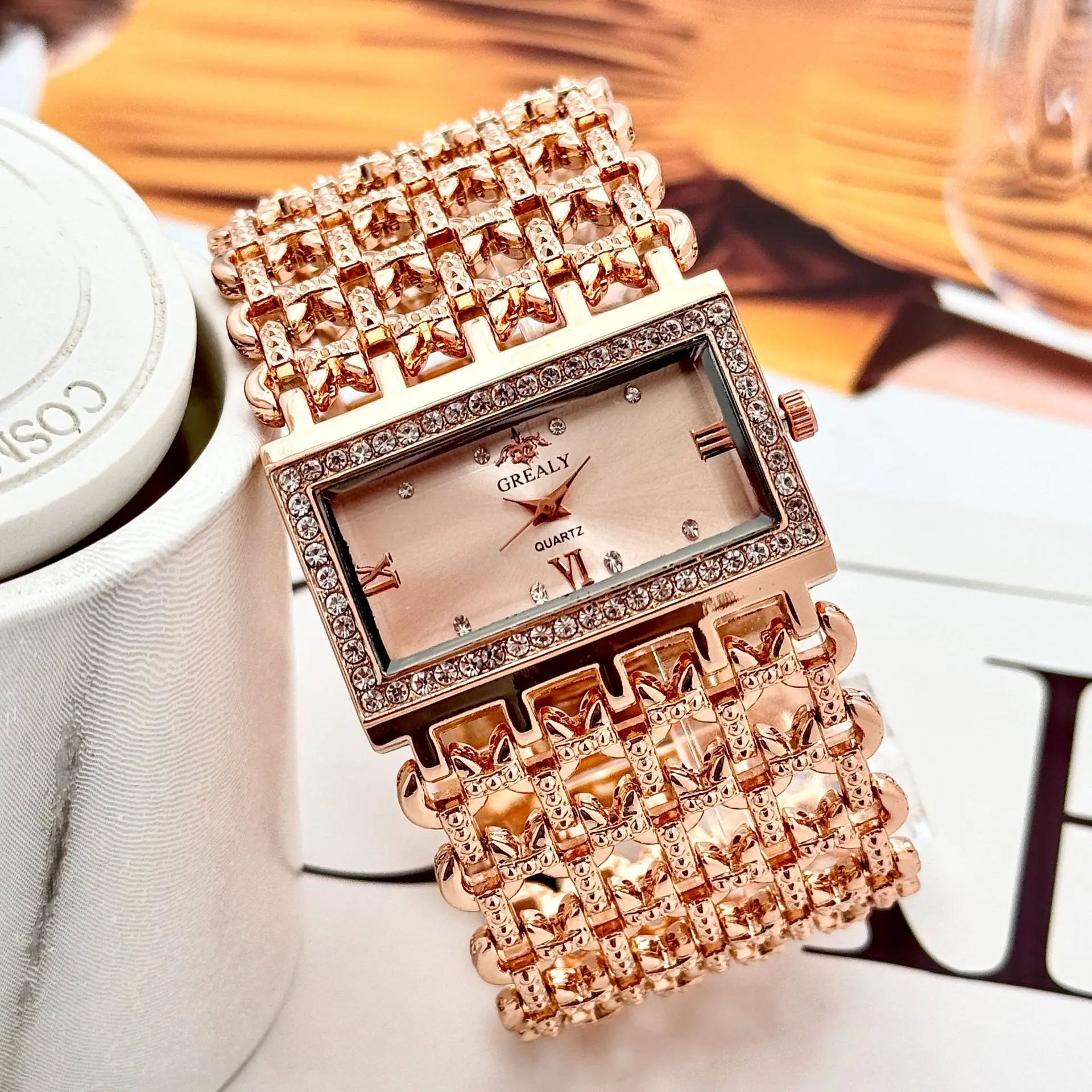 Gold Square Diamond Watch with Roman Dial & Wide Bracelet — feature 12
