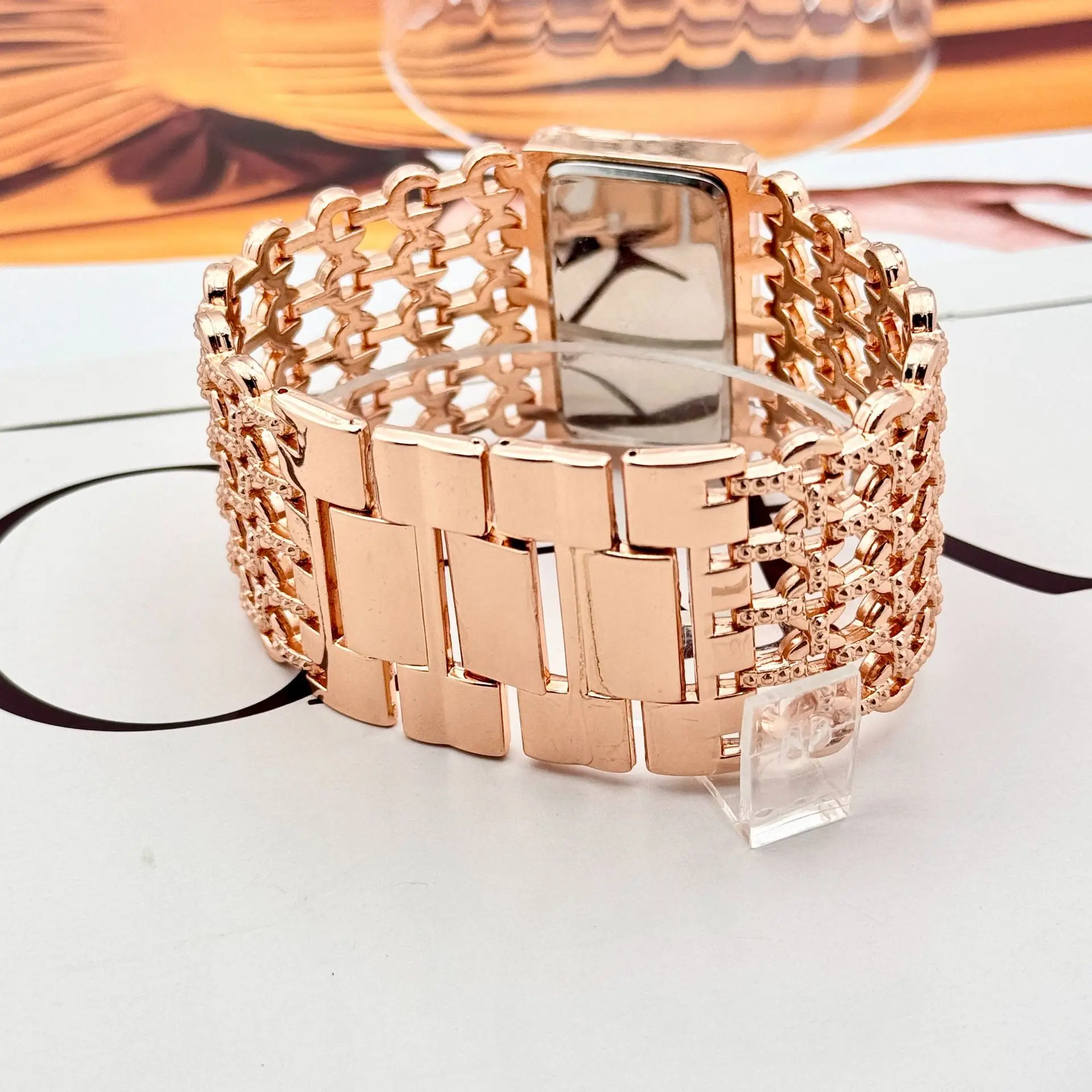 Gold Square Diamond Watch with Roman Dial & Wide Bracelet — feature 16