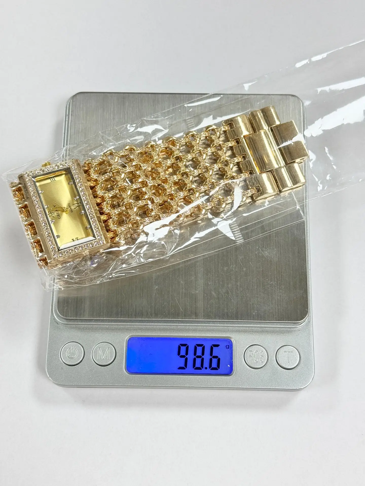 Gold Square Diamond Watch with Roman Dial & Wide Bracelet — feature 2