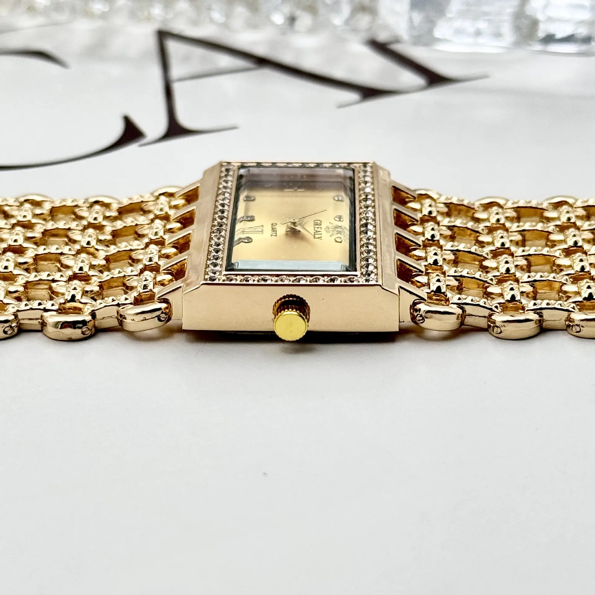 Gold Square Diamond Watch with Roman Dial & Wide Bracelet — feature 9