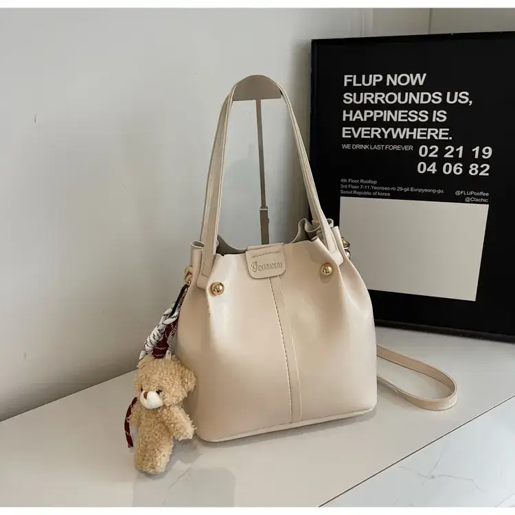 Women's Brown Leather Shoulder Bag with Pom Pom Charm — feature 16