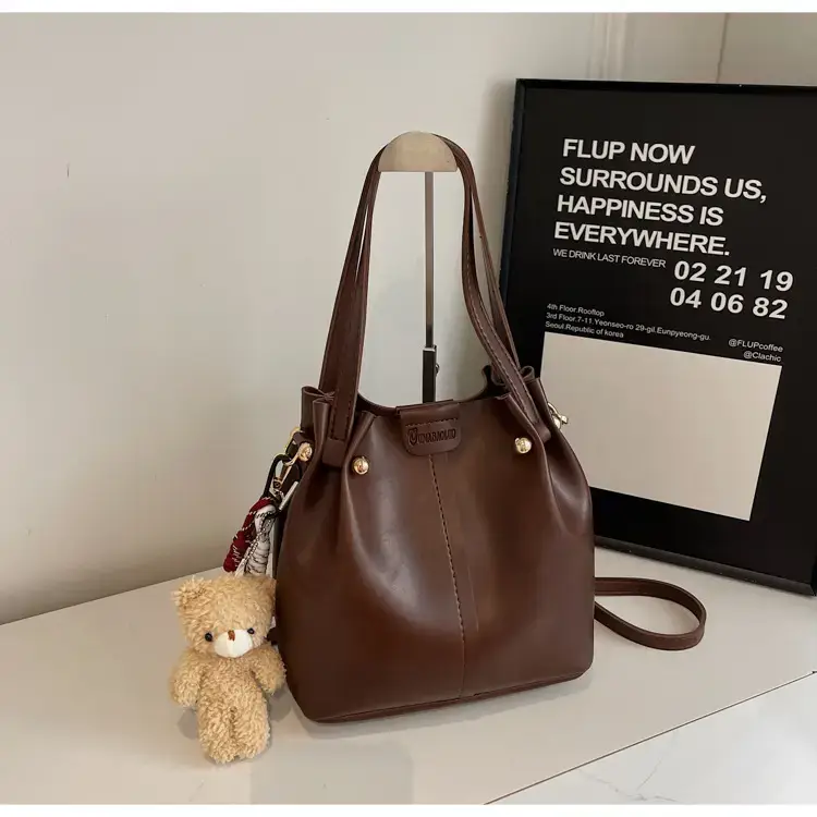 Women's Brown Leather Shoulder Bag with Pom Pom Charm — feature 17