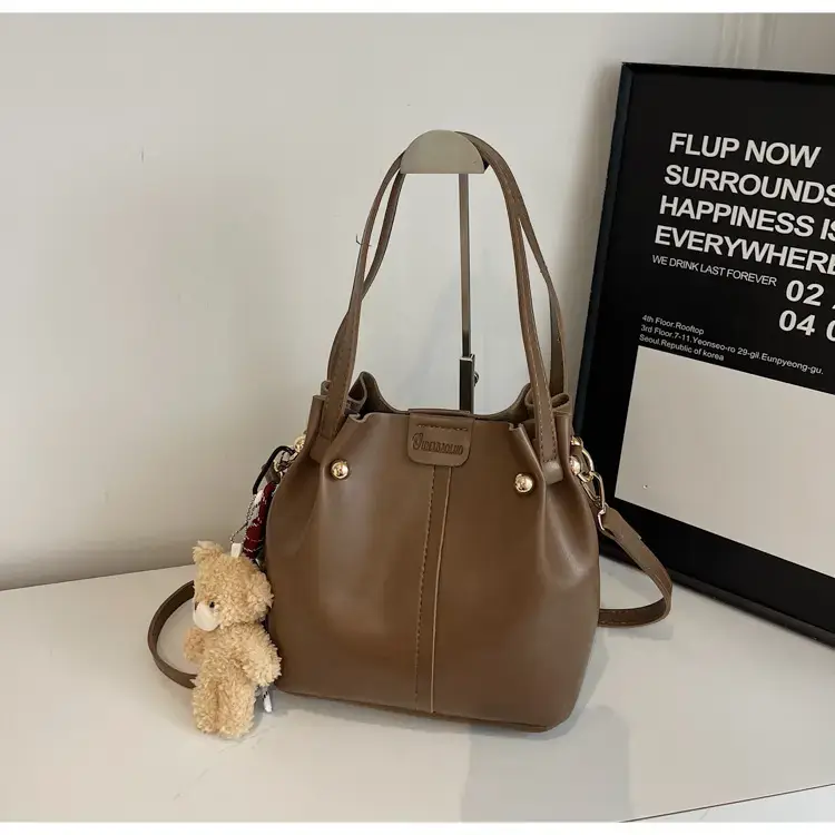 Women's Brown Leather Shoulder Bag with Pom Pom Charm — feature 18
